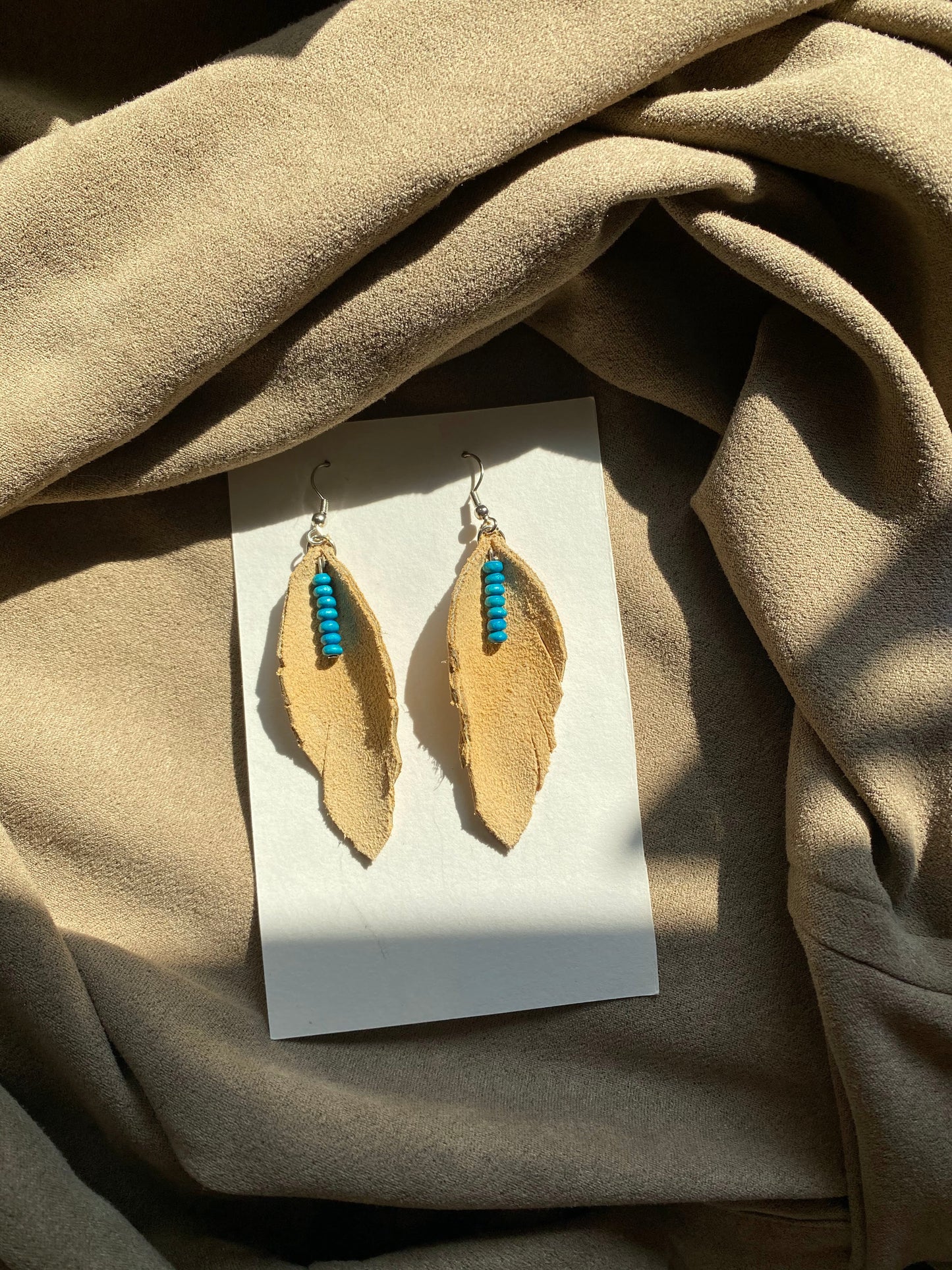 Tan Suede Feathers