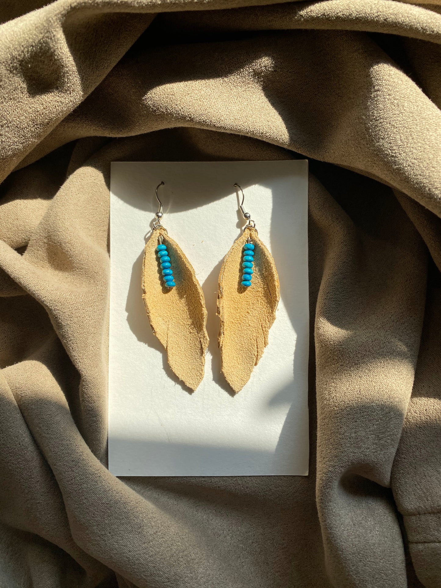 Tan Suede Feathers