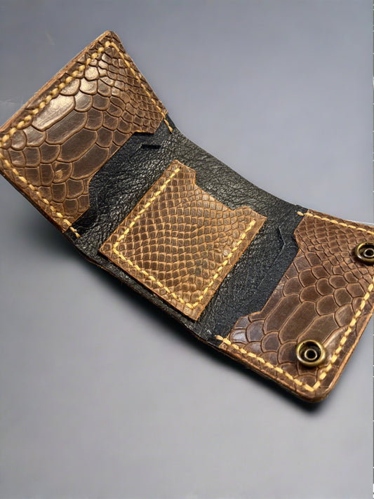 Brown snake embossed leather trifold wallet.